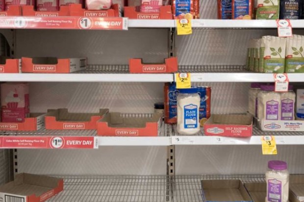 Depleted shelves of flour at the Coles supermarket in Woy Woy, NSW.