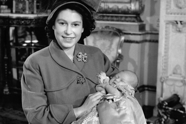 Princess Elizabeth, now the Queen, with Prince Charles on his christening day, 1948.