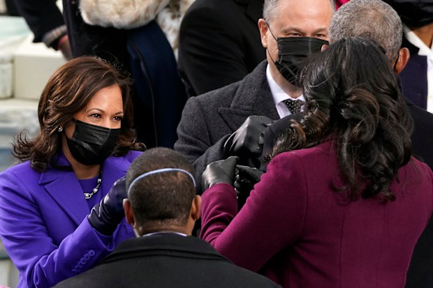 Vice President-elect Kamala Harris and her husband Doug Emhoff greet former President Barack Obama and former first lady Michelle Obama during the 59th Presidential Inauguration at the U.S. Capitol in Washington, Wednesday, Jan. 20, 2021. (AP Photo/Andrew Harnik)