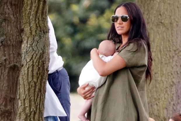 Meghan and Archie watch Prince Harry play the polo.