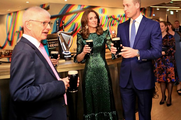 Prince William, Duke of Cambridge and Catherine, Duchess of Cambridge hold a pint of Guinness as they visit the Guinness Storehouses Gravity Bar