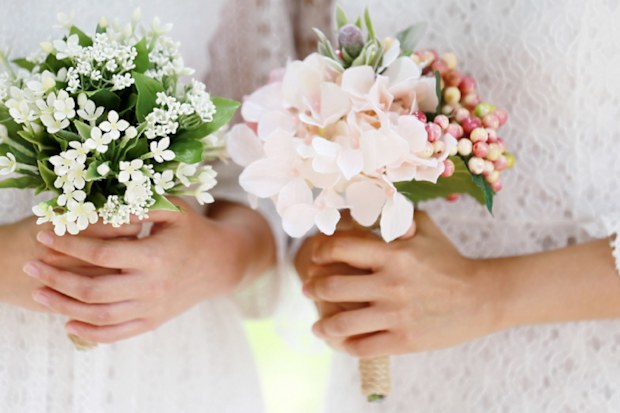 Girls holding wedding bouquet