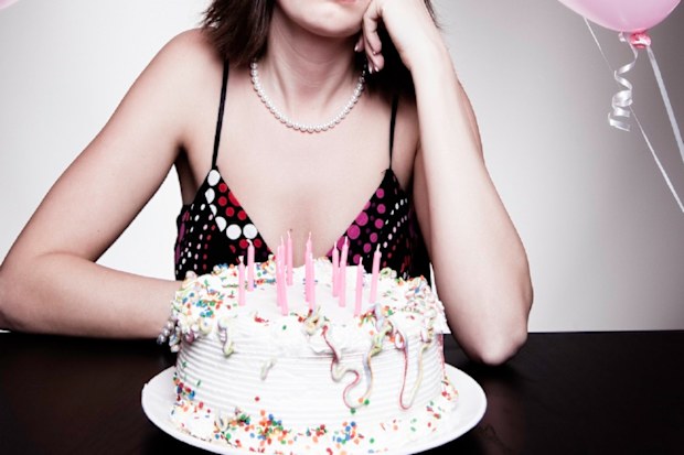 Sad woman birthday cake photo