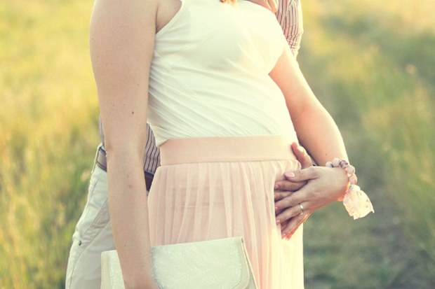 Pregnant woman wedding guest