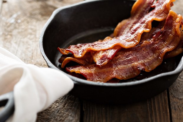 Cooking bacon in a pan.