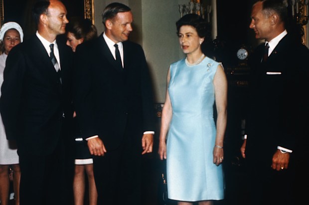 Michael Collins, Neil Armstrong, and Buzz Aldrin with Queen Elizabeth at Buckingham Palace.