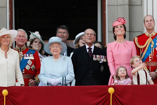 Members of Britain's Royal family from left, Camilla, the Duchess of Cornwall, Prince Charles, Princess Eugenie, Queen Elizabeth II, background Timothy Laurence, Princess Beatrice, Prince Philip, Kate, the Duchess of Cambridge, Princess Charlotte, Prince George and Prince William watch a fly past as they appear on the balcony of Buckingham Palace at Trooping the Colour
