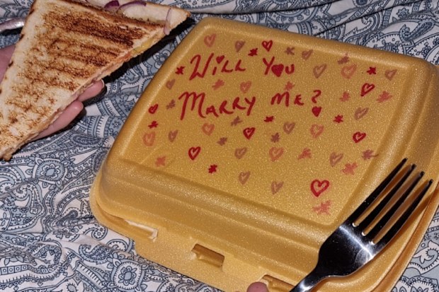 Marriage proposal written on takeaway food container
