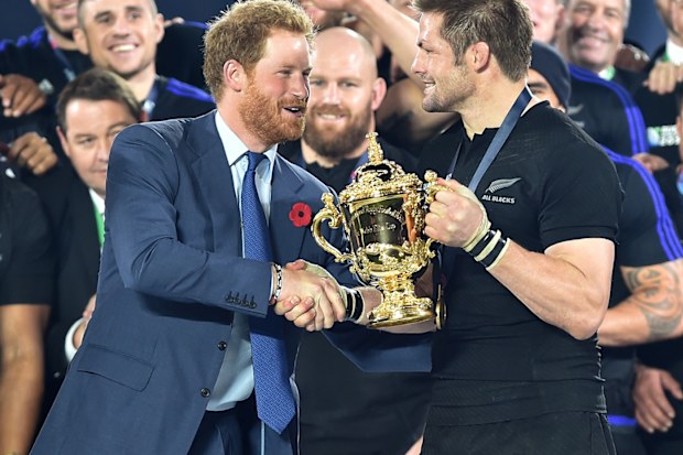 Prince Harry presents Richie McCaw with the Webb Ellis Cup after New Zealand beat Australia in the 2015 Rugby World Cup Final 