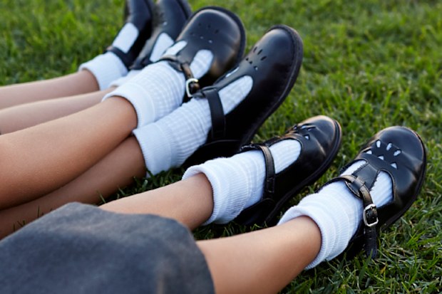 Close up of school shoes on kids feet