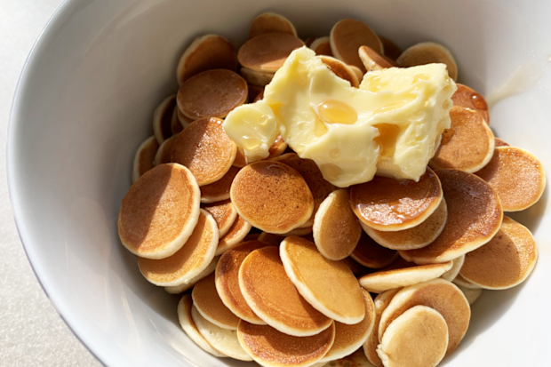 Pancake cereal with butter and maple syrup