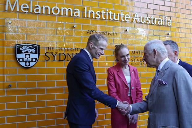 King Charles III is greeted by co-medical directors Georgina Long and Richard Scolyer during a visit to the Melanoma Institute of Australia on October 22, 2024 in Sydney, Australia. 