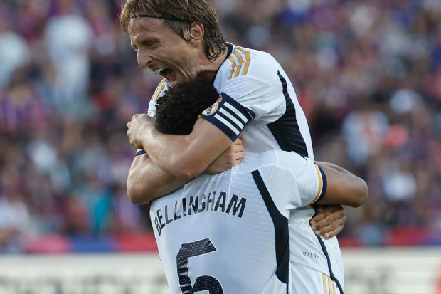 Real Madrid captain Luka Modric celebrates with Bellingham after his game-winner