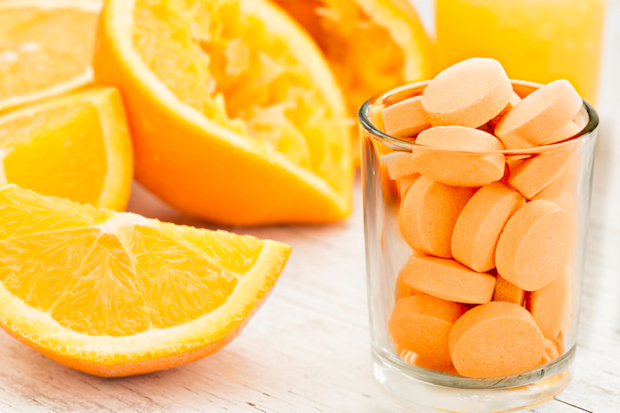 Vitamin C next to oranges