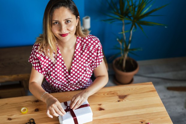 Woman wrapping Christmas presents
