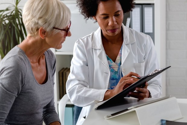 Woman having check-up with doctor.