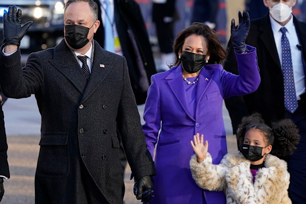 Vice President Kamala Harris, and her husband Doug Emhoff, and family, walk in front of the White House during a Presidential Escort to the White House, Wednesday, Jan. 20, 2021 in Washington, after being sworn in as the 46th vice president of the United States. (AP Photo/Jacquelyn Martin)