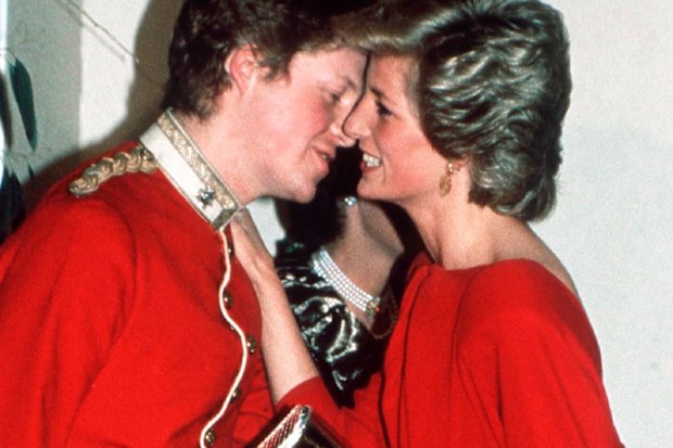 Princess Diana greets her brother Charles at a charity ball.