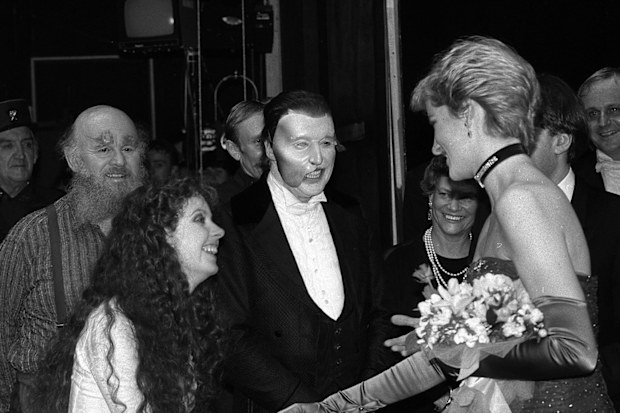 Phantom of the Opera star Michael Crawford (masked) and Sarah Brightman meet Diana, Princess of Wales after a charity performance of the hit musical at her Majesty's Theatre in London. 