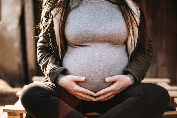 A US woman is alleging her civil rights were breached after she was jailed 39 days when she was pregnant for refusing a paternity test.