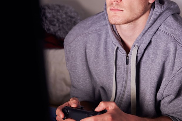 Adult man playing video games