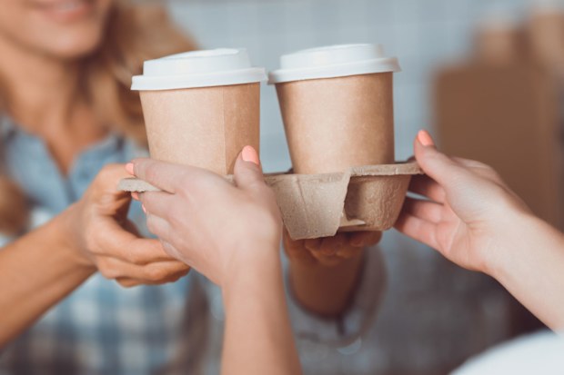 Woman buying takeaway coffee
