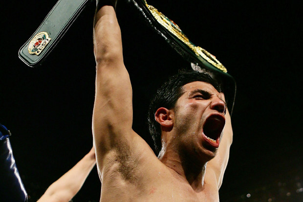 Billy Dib celebrates winning the IBO World Middleweight title over Zolani Marali in 2008
