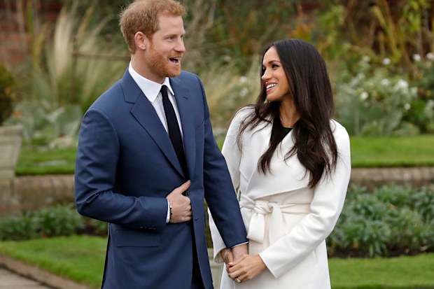 Prince Harry and fiancee Meghan Markle pose for photographers during a photocall announcing their engagement.