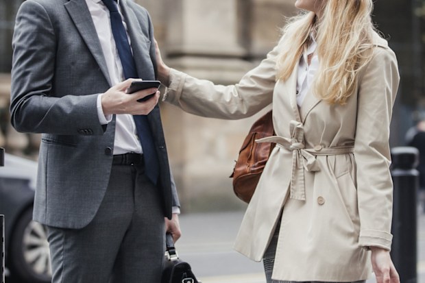 Man and woman chatting on street