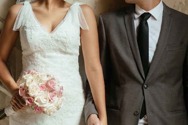 Newlywed couple in wedding outfits
