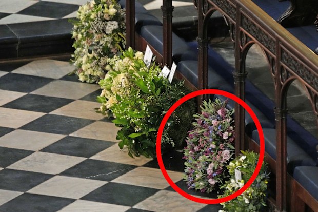 Meghan and Harry's wreath for the Duke of Edinburgh's funeral. Wreaths from members of the royal family lie against the pews during the funeral of Prince Philip, Duke of Edinburgh at Windsor Castle on April 17, 2021 in Windsor, United Kingdom
