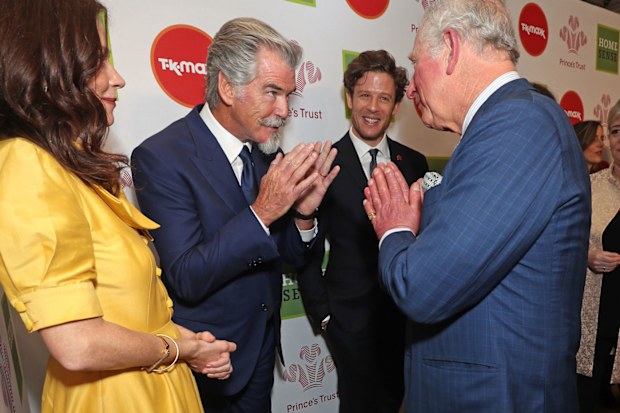 Charles greets Anna Friel, Pierce Brosnan and James Norton at the Prince's Trust Awards.