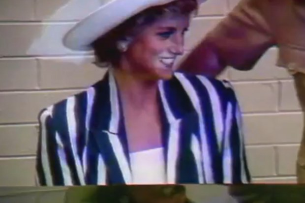 Princess Diana plays piano during 1988 Australia tour