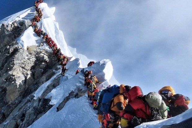A long queue of mountain climbers line a path on Mount Everest, in this photograph that made headlines around the world.