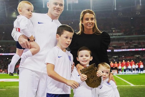 Wayne and Coleen Rooney pictured with their four boys (L - R) Cass, Kai, Klay and Kit