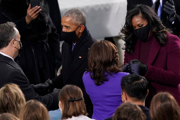 President-elect Kamala Harris and her husband Doug Emhoff talk with former President Barack Obama and his wife Michelle as they arrive for the 59th Presidential Inauguration at the U.S. Capitol in Washington, Wednesday, Jan. 20, 2021. (AP Photo/Carolyn Kaster)