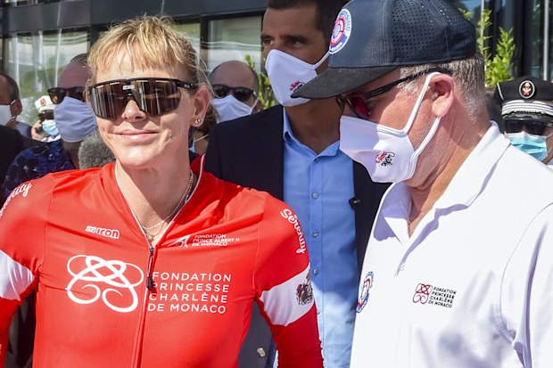 Princess Charlene of Monaco with Prince Albert after her water bike challenge.