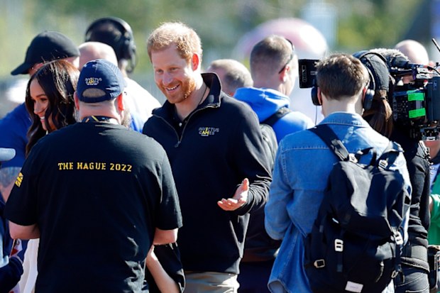THE HAGUE, NETHERLANDS - APRIL 17: (EMBARGOED FOR PUBLICATION IN UK NEWSPAPERS UNTIL 24 HOURS AFTER CREATE DATE AND TIME) Meghan, Duchess of Sussex and Prince Harry, Duke of Sussex (accompanied by a film crew) meet athletes and their supporters at the athletics competition on day 2 of the Invictus Games 2020 at Zuiderpark on April 17, 2022 in The Hague, Netherlands. (Photo by Max Mumby/Indigo/Getty Images)
