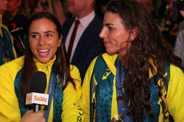 Sisters Noemie and Jessica Fox, Gold medalists in Women's Kayak Single and Canoe Single and Women's Kayak Cross, are interviewed during the Australian Olympic Games athletes charter flight arrival at Sydney International Airport on August 14, 2024 in Sydney, Australia. 