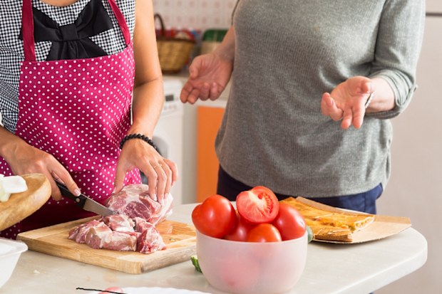 wife and mother in law cooking in the kitchen together before dinner