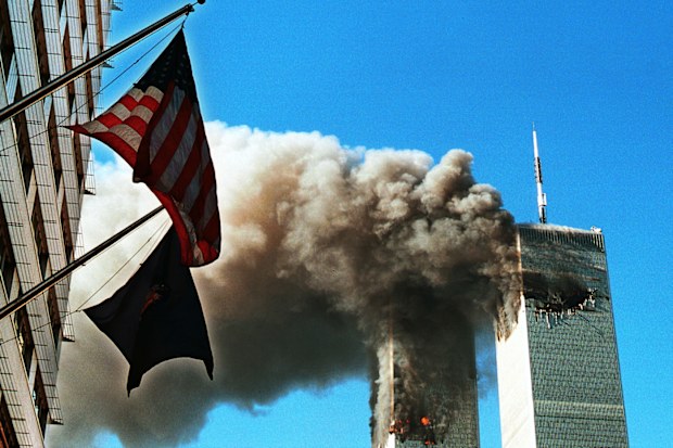 Dark, toxic smoke pours from the twin towers of the World Trade Center on September 11, after two hijacked planes hit each structure, later causing each to crash to the ground.