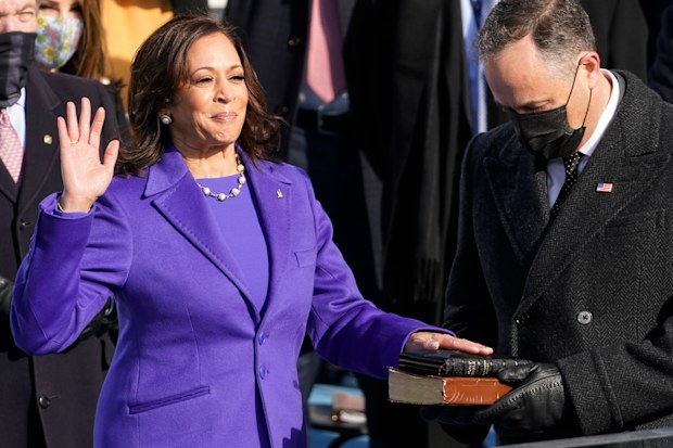 Kamala Harris is sworn in as vice president by Supreme Court Justice Sonia Sotomayor as her husband Doug Emhoff holds the Bible during the 59th Presidential Inauguration at the U.S. Capitol in Washington, Wednesday, Jan. 20, 2021. (AP Photo/Andrew Harnik)