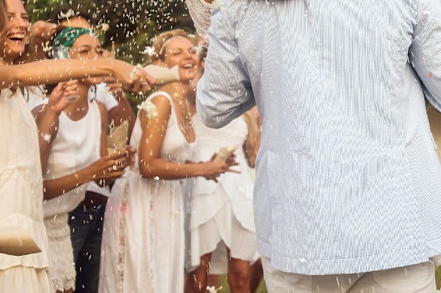 Wedding guests wearing white debate