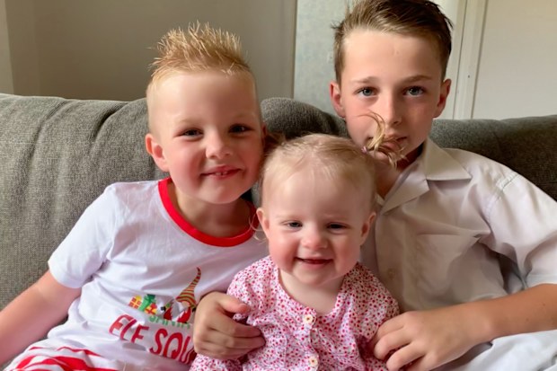 Willow with her brothers before her cancer treatment.
