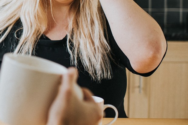 Couple fighting over coffee at home