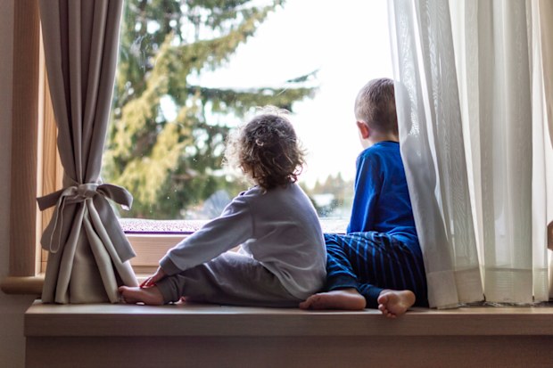Two children at window