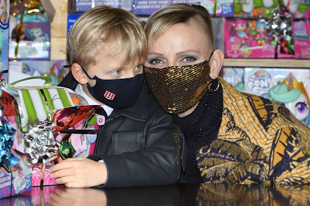 Prince Jacques of Monaco  and Princess Charlene of Monaco attend the Christmas gift distribution on December 16, 2020 in Monaco, Monaco. 