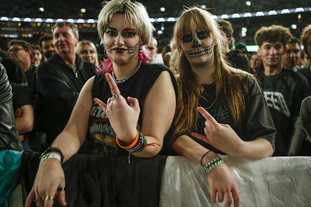 Metallica fans Daphne Gattari (left) and Paige Scott prepare for the US heavy metal band's performance on their M72 World Tour at Marvel Stadium on November 8, 2025 in Melbourne, Australia. 