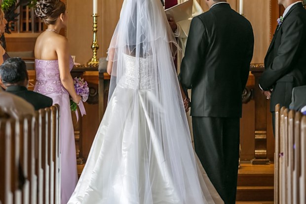 Bride and groom standing at altar during wedding ceremony divorce
