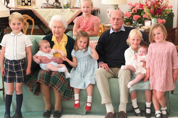 The Queen and Prince Philip surrounded by seven of their great-grandchildren at Balmoral Castle in 2018 (L-R front: Prince George, Queen with Prince Louis, Princess Charlotte, Prince Philip, Isla Phillips, Lena Tindall, Mia Tindall. Back: Savannah Phillips)